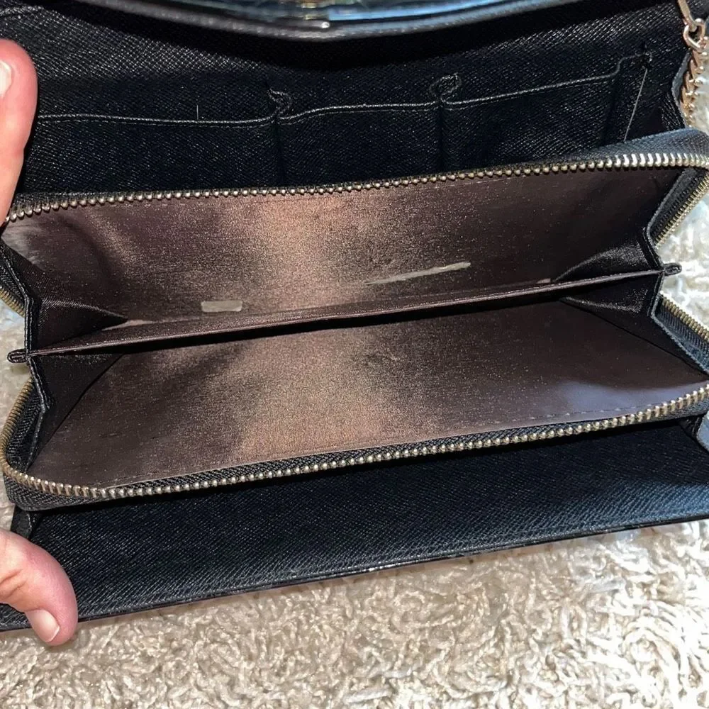 Awesome patent leather skull embossed clutch bag with gold chain shoulder strap.
